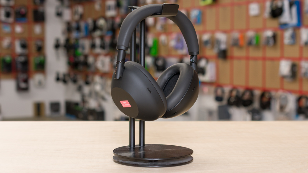 The Sony WH-1000XM6 headphones on a headphone stand.