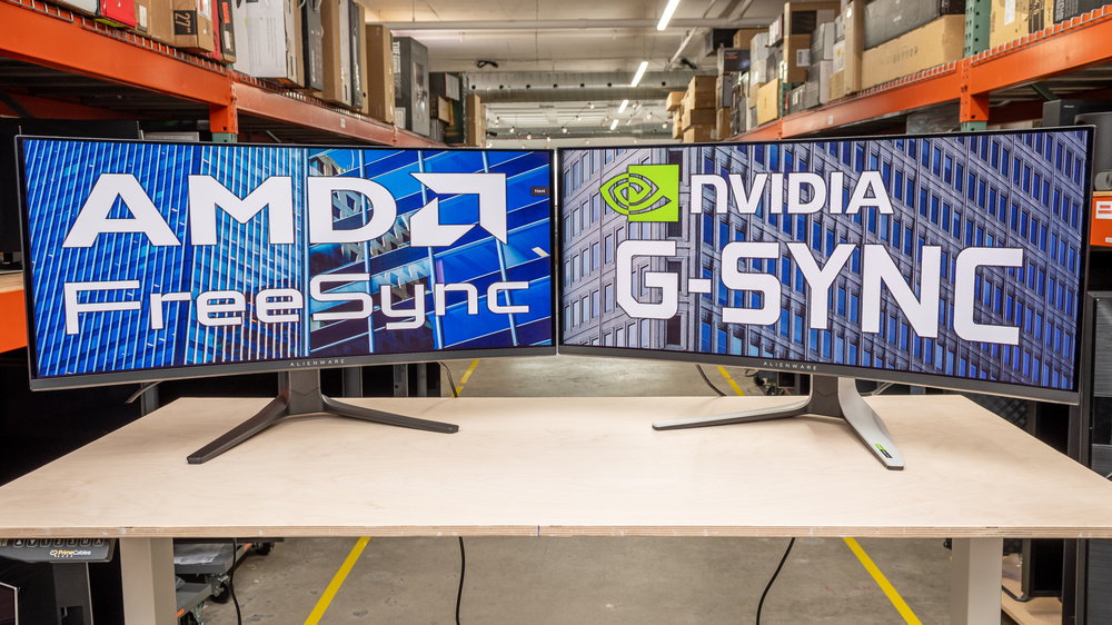 Two monitors next to each other; one says "AMD FreeSync," and one says "NVIDIA G-SYNC."